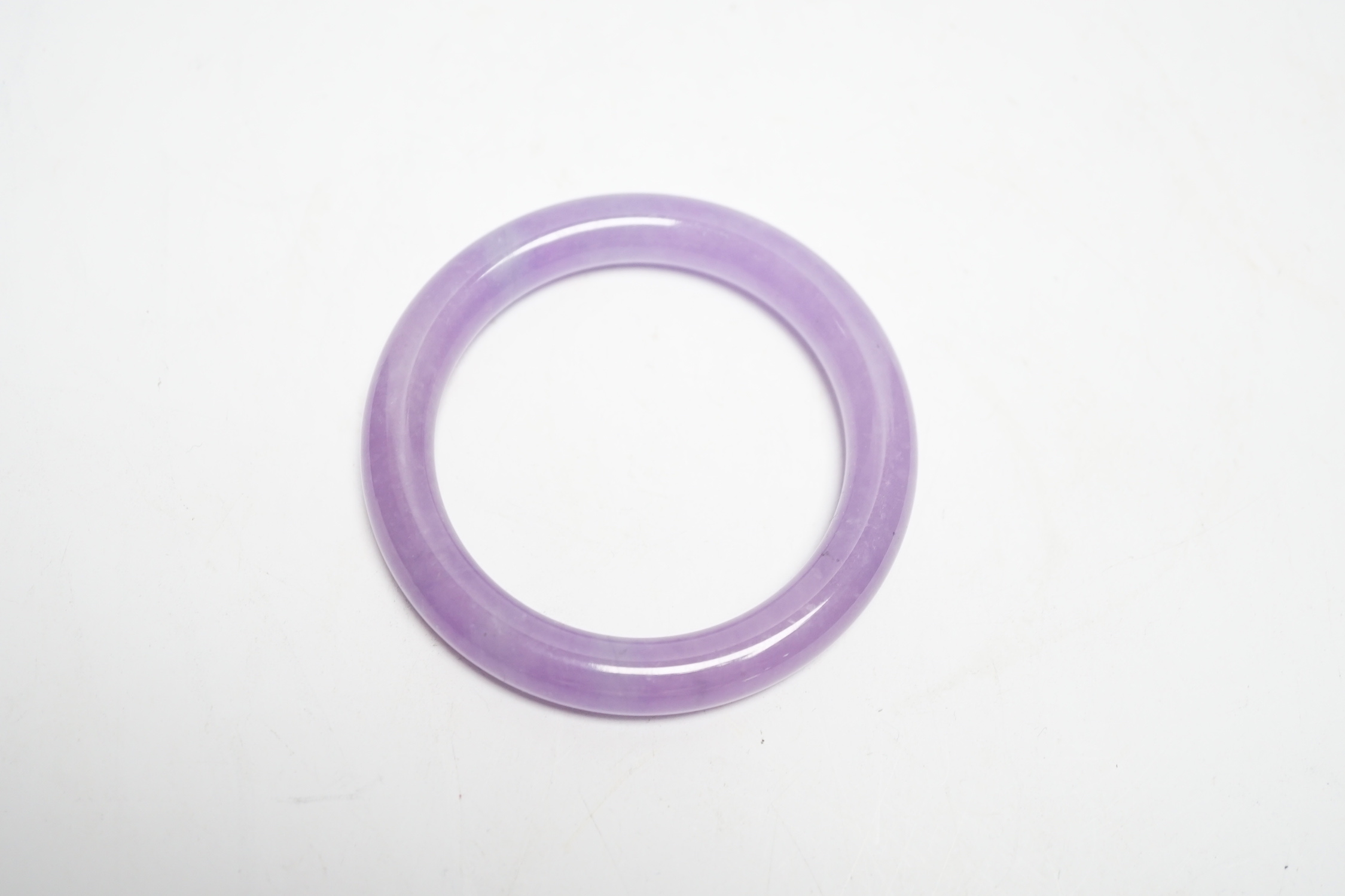 A Chinese lavender hardstone bangle